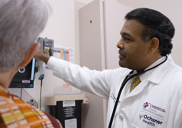 Dr. Daniel Beckles explaining a diagnosis to a patient. 