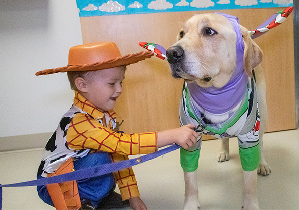 Lane with Marcus dressed up as Woody and Buzz