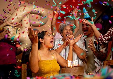 A woman is celebrating her birthday with her family