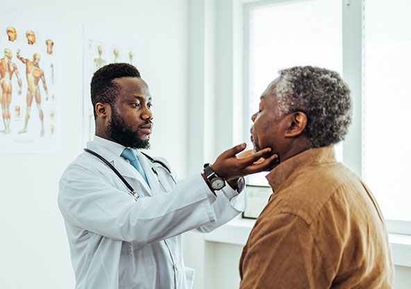 Patient at the doctor's office getting checked for a sinus infection