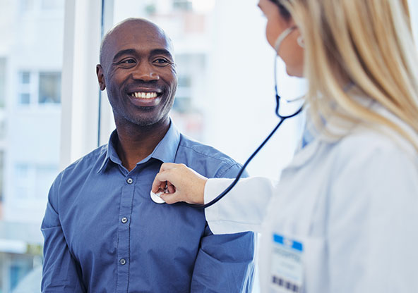 Doctor checks a patient's heart health. 